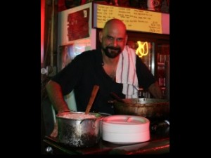 Martin Krusche cooking curry at Saturn Bar. Photo courtesy of Martin.